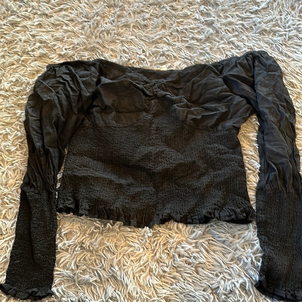 ASOS Women’s Long Sleeved Blouse. Size 14. Plain black with ruffles at the end.